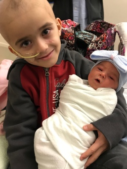Nico came with Nick to pick us up and bring us home from the hospital. He really is smitten with his sister.